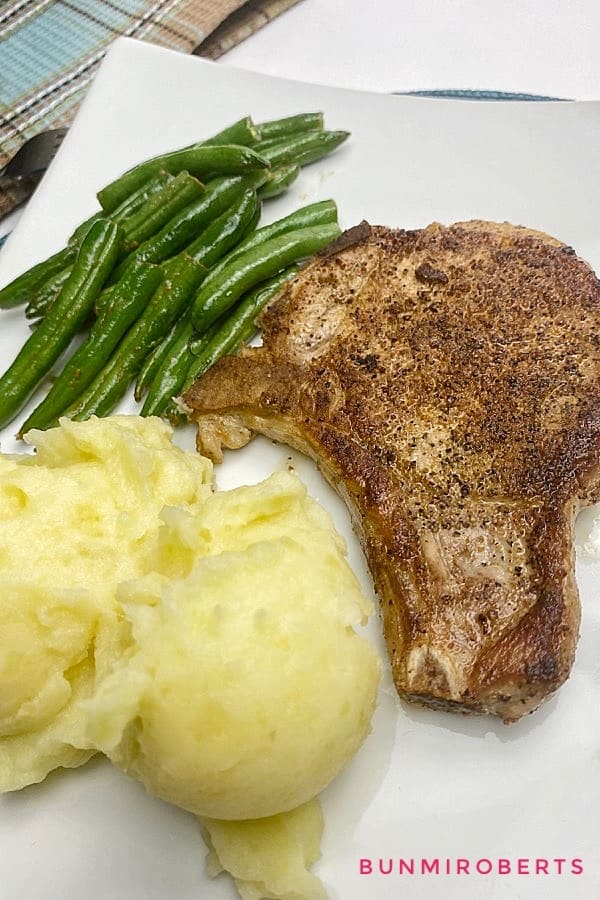mashed potatoes, green beans and pan seared pork chops