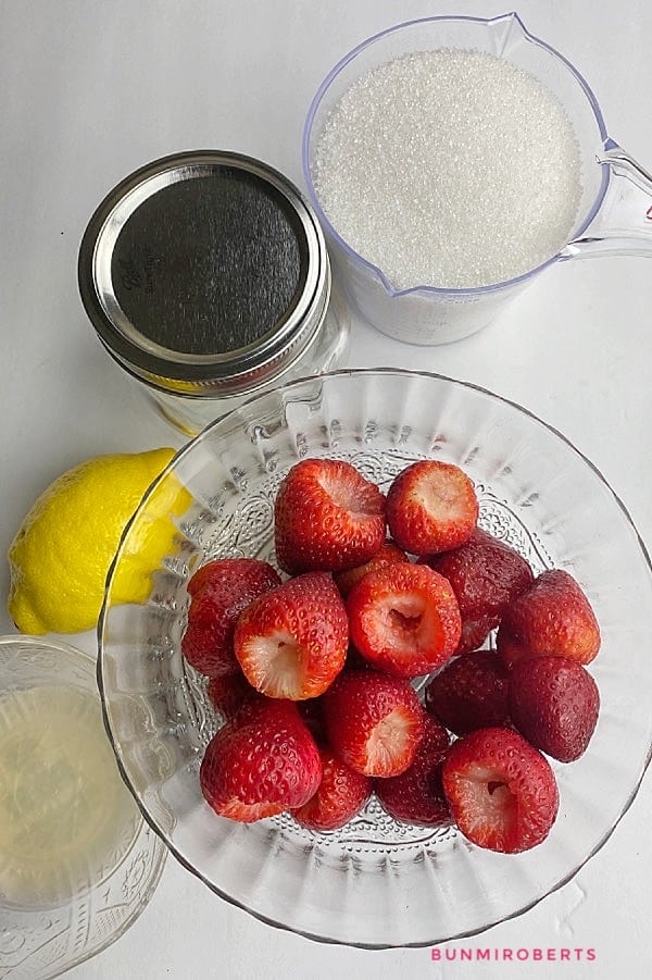 fresh strawberries, sugar, lemon, liquid pectin and a mason jar