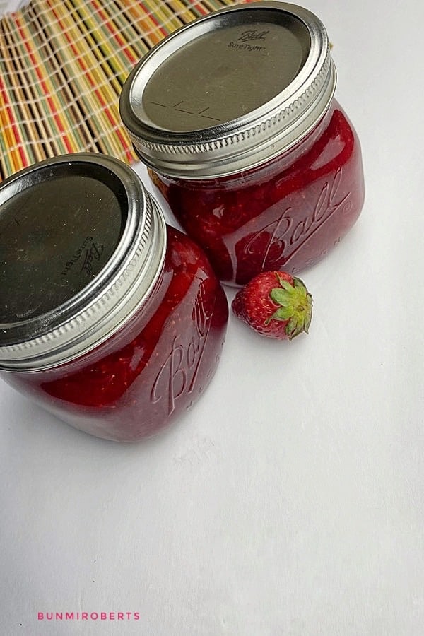 fresh strawberry jam in two mason jar
