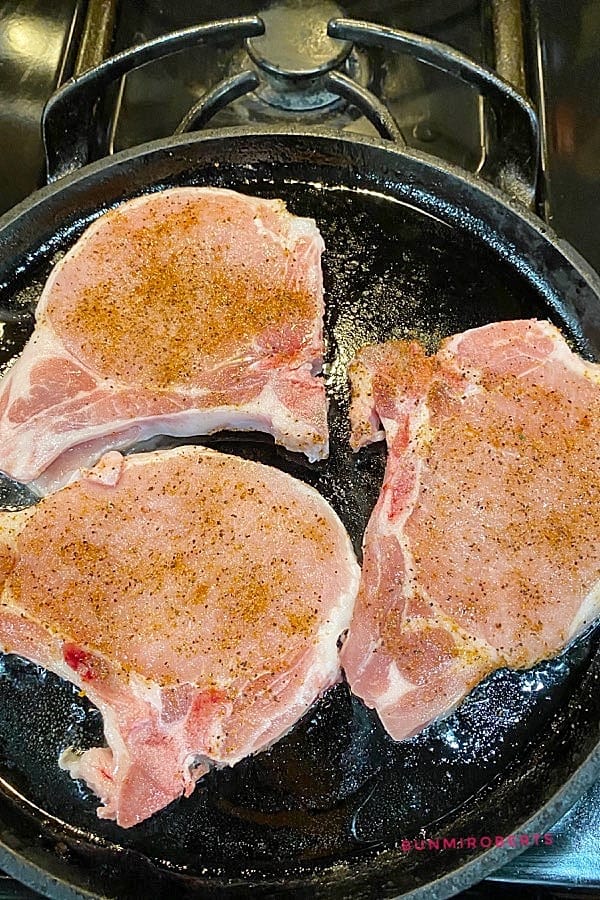 pork chops in a cast iron skillet