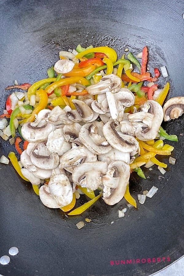 sliced mushroom, sliced bell peppers, garlic and onions stir fry