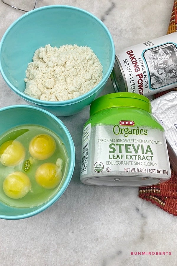 eggs in a bowl, stevia, almond flour and baking powder for keto waffles